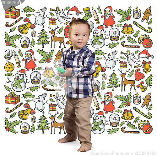 Image of Little Boy Looking For Christmas Gifts