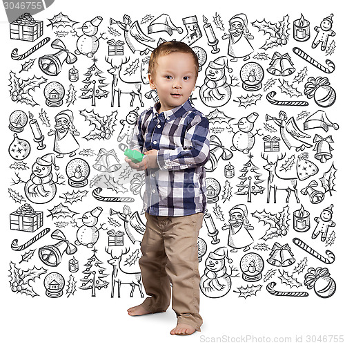 Image of Little Boy Looking For Christmas Gifts