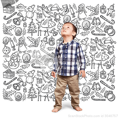 Image of Little Boy Looking For Christmas Gifts