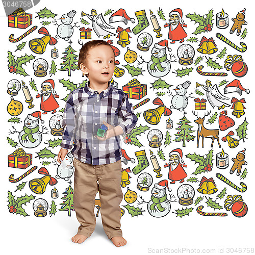 Image of Little Boy Looking For Christmas Gifts