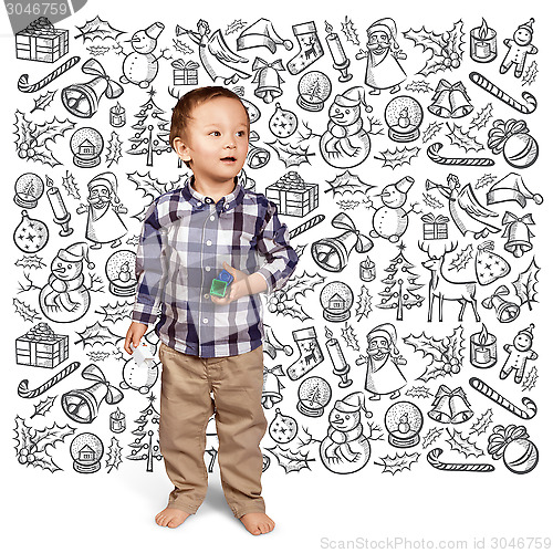 Image of Little Boy Looking For Christmas Gifts