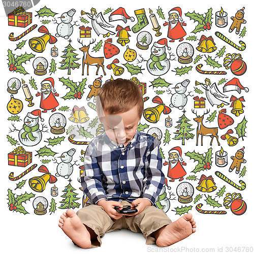 Image of Little Boy Looking For Christmas Gifts