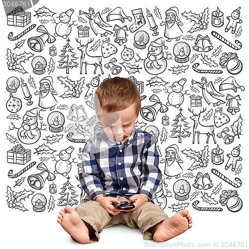 Image of Little Boy Looking For Christmas Gifts