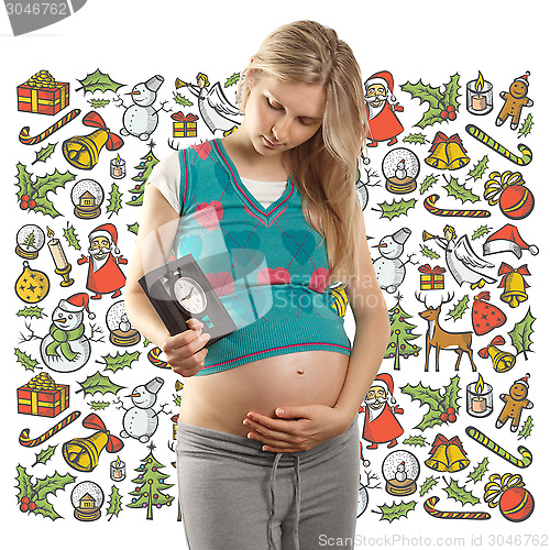 Image of Pregnant Woman Looking For Christmas Gifts