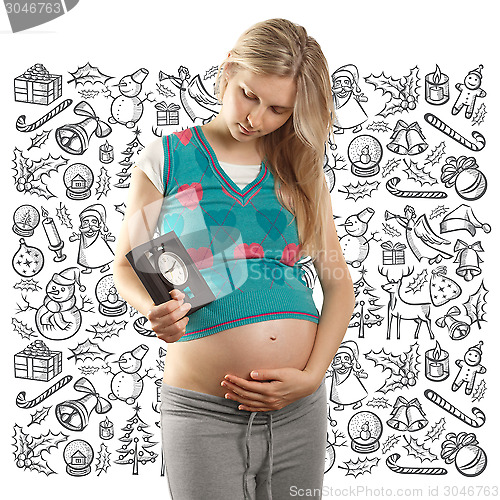 Image of Pregnant Woman Looking For Christmas Gifts