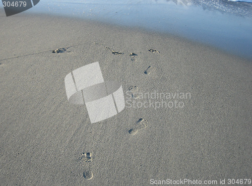 Image of Footprints in sand, Crete, Greece