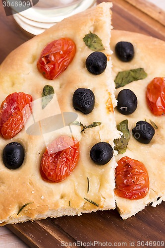 Image of Focaccia with black olives, tomatoes and basil