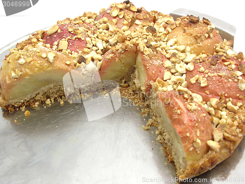 Image of Cutted  wholemeal apple cake  on a cake tray 