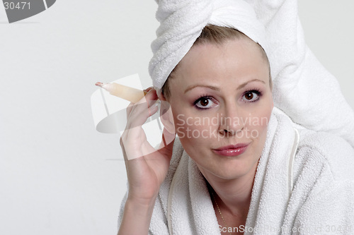 Image of Pretty lady in bathrobe and towel