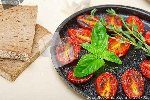 Image of baked cherry tomatoes with basil and thyme