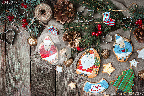 Image of Christmas pastry and decorated cookies in rustic style