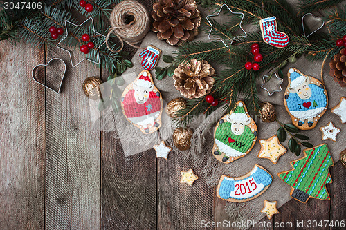 Image of Christmas decoration and holiday cookies on wood