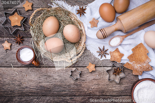 Image of Christmas homemade cookies and ingredients in rustic style