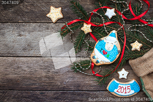 Image of Xmas and New Year 2015 sheep cookie and pastry on wood