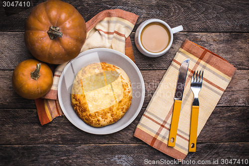 Image of Lunch coffee with flatbread and pumpkins on wooden table