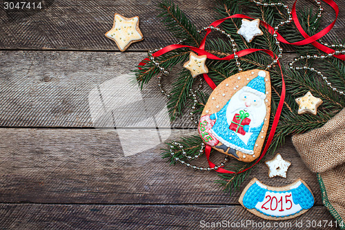 Image of Christmas Santa in blue and New Year star cookies