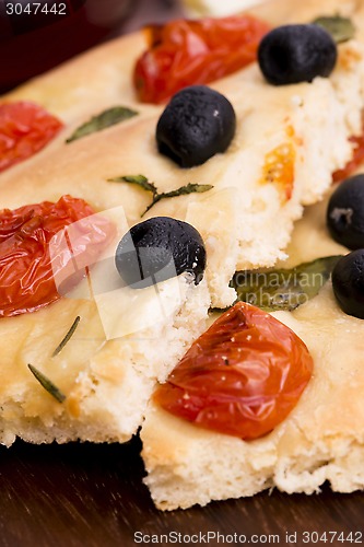 Image of Focaccia with black olives, tomatoes and basil