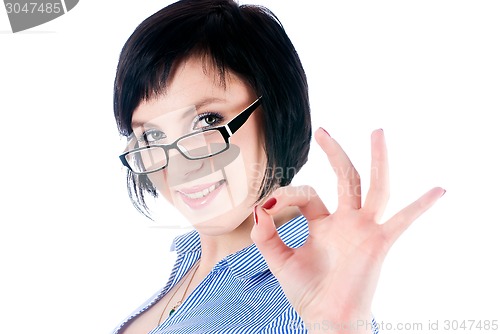 Image of Pretty woman showing okay gesture