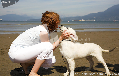 Image of kiss to her dog