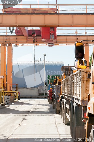 Image of Queue of trucks stands for loading