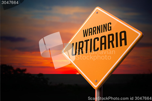 Image of Urticaria on Warning Road Sign.