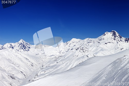 Image of Snowy mountain peaks in sun nice day