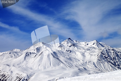 Image of Winter snowy mountains in windy day