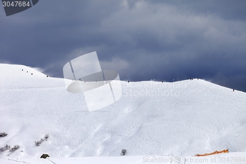 Image of Off-piste slope and gray sky in bad weather day