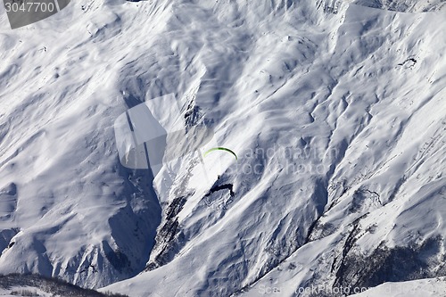 Image of Speed riding in winter mountains at sun day