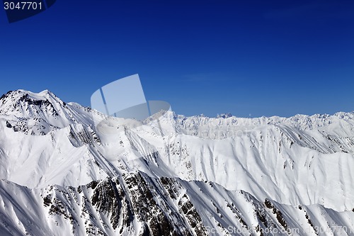 Image of Snowy mountains in sun day