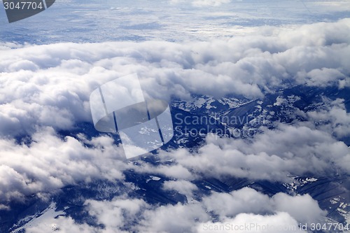 Image of Top view on fields and hills in mist