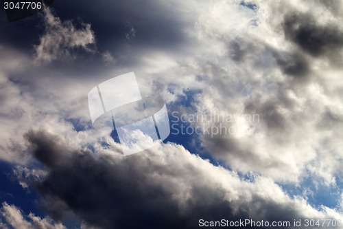 Image of Blue sky with dark clouds