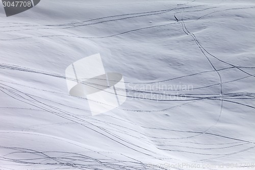 Image of Off-piste slope with traces of skis and snowboarding