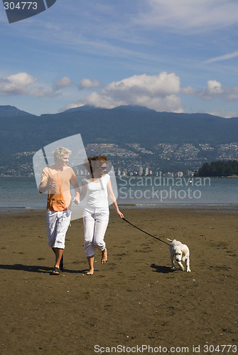 Image of young couple on the beach