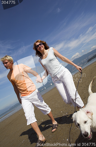 Image of young couple on the beach