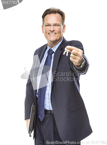 Image of Handsome Real Estate Agent Holding Out Keys to New Home