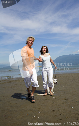 Image of young couple on the beach