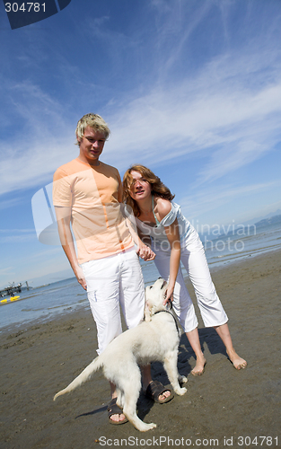 Image of young couple on the beach