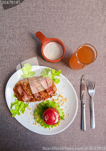 Image of veal meat with bacon