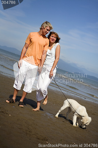 Image of young couple on the beach