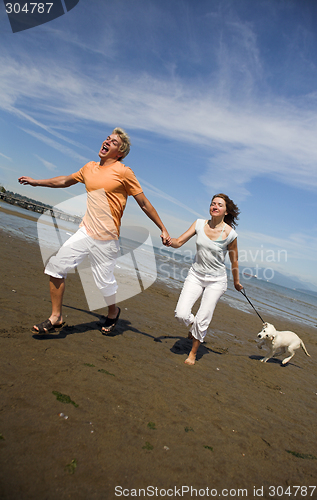 Image of young couple on the beach