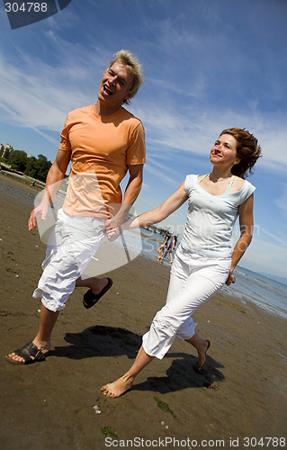 Image of young couple on the beach