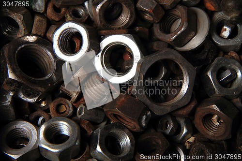 Image of old steel nuts background