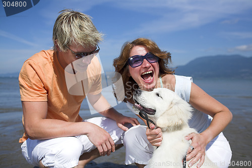 Image of young couple on the beach