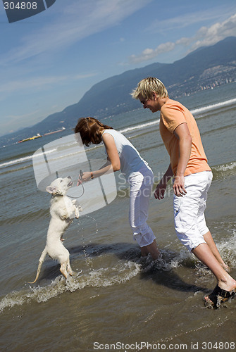 Image of young couple on the beach