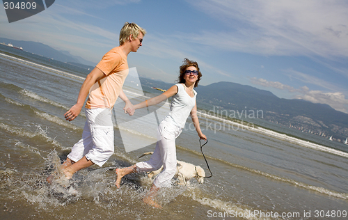 Image of young couple on the beach