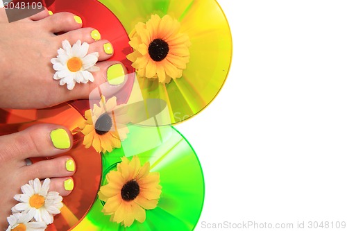 Image of women feet (pedicure)  with flowers