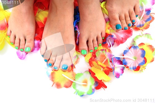 Image of women feet (pedicure)  with flowers