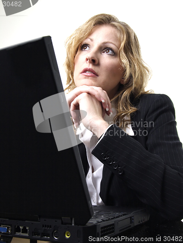 Image of Business woman daydreaming