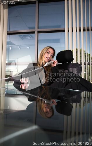 Image of sitting at her desk